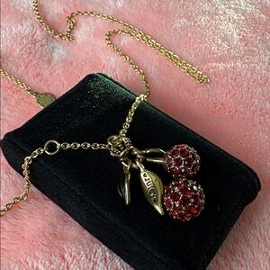 Cherry “Juicy” Couture. 
Red Crystal Cherries with Green enamel leaves Necklace.